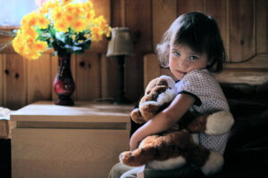 Little Girl Hugging Teddy Bear